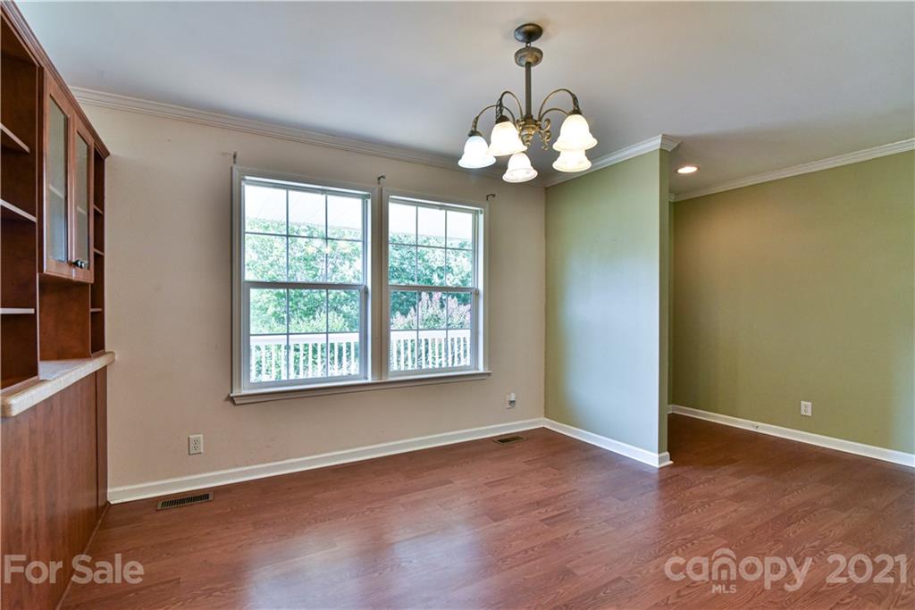 699 Pleasant Hill Road Clyde, NC 28721 - Photo 7 of 32 a view of a room with a large window and chandelier