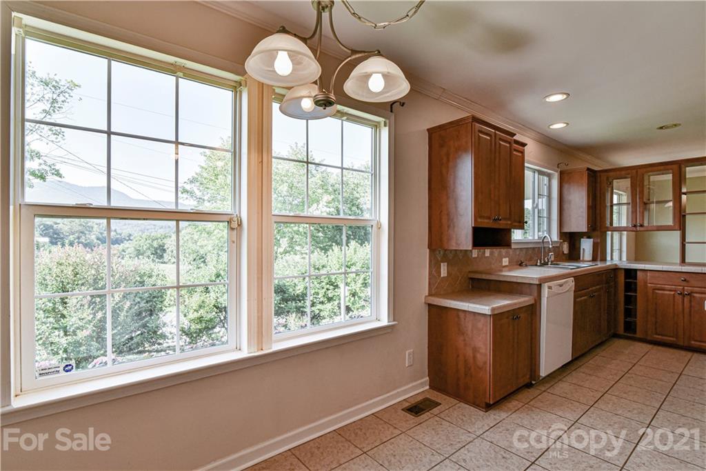 699 Pleasant Hill Road Clyde, NC 28721 - Photo 10 of 32 a kitchen with a window and cabinets