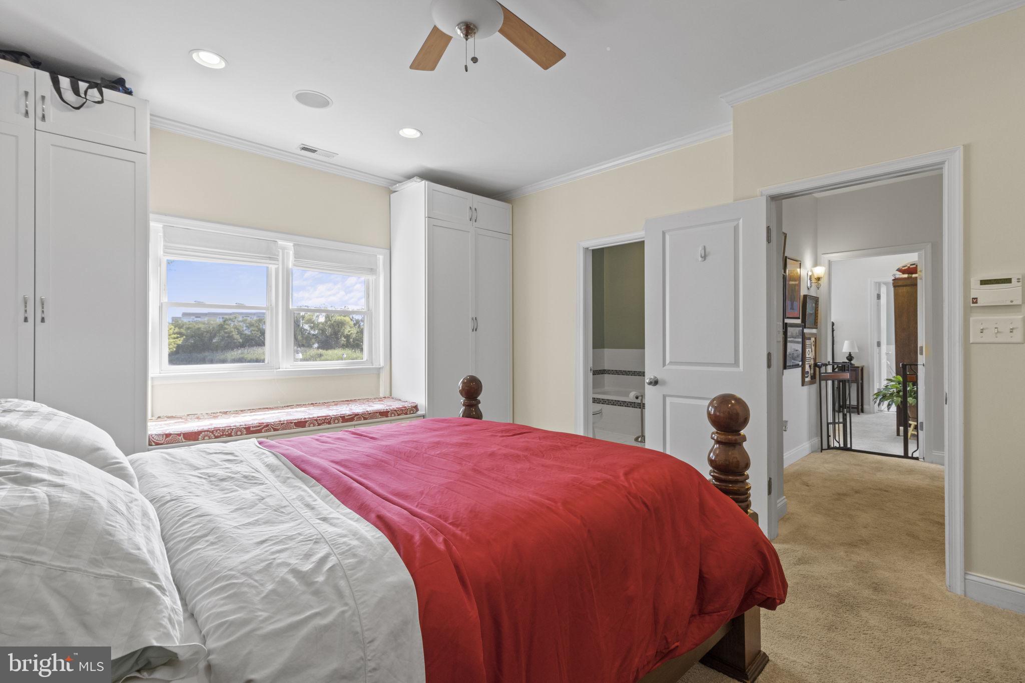 8646 Sandy Plains Road Dundalk, MD 21222 - Photo 17 of 38 a bedroom with a large bed and a large window