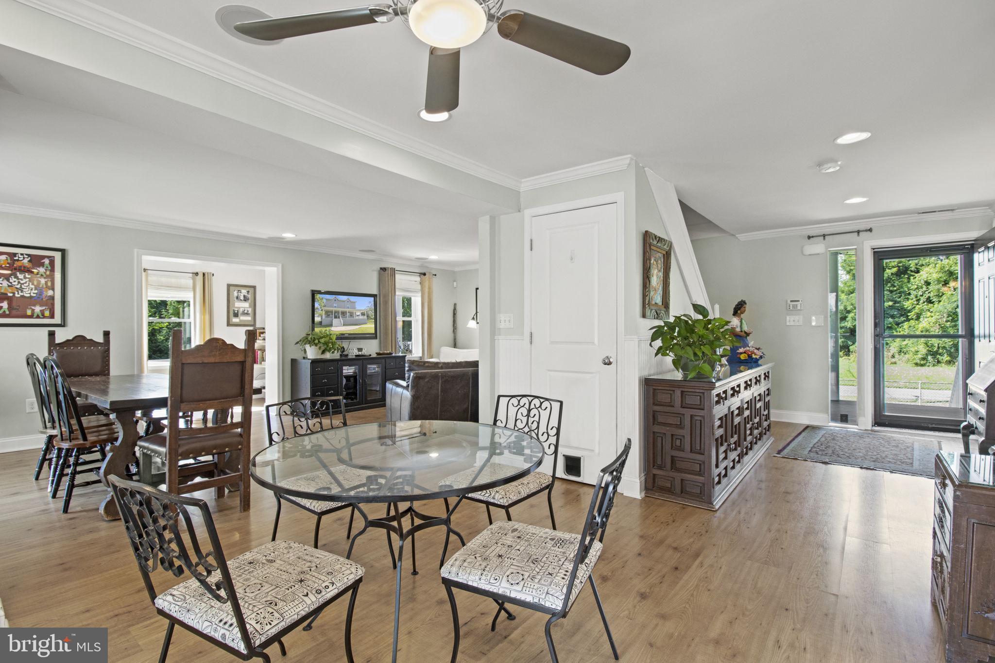 8646 Sandy Plains Road Dundalk, MD 21222 - Photo 10 of 38 a view of a dining room with furniture window and wooden floor