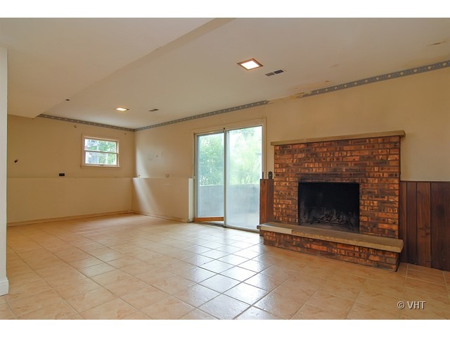 431 North Midlothian Road Mundelein, IL 60060 - Photo 4 of 10 a view of empty room with a fireplace
