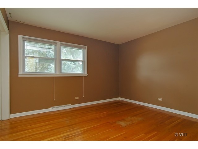 431 North Midlothian Road Mundelein, IL 60060 - Photo 7 of 10 an empty room with wooden floor and windows