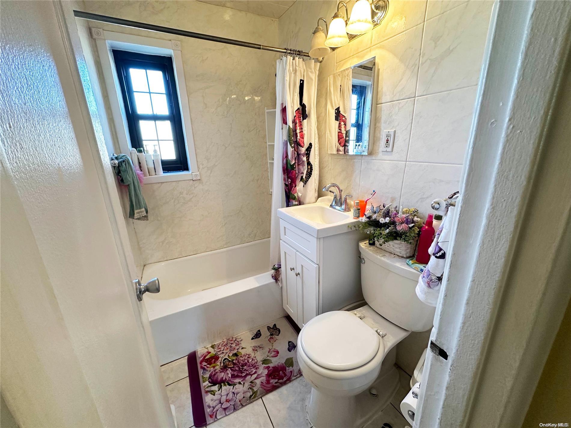 141-30 77th Road, Unit 3A Queens, NY 11367 - Photo 13 of 19 a bathroom with a sink toilet and shower