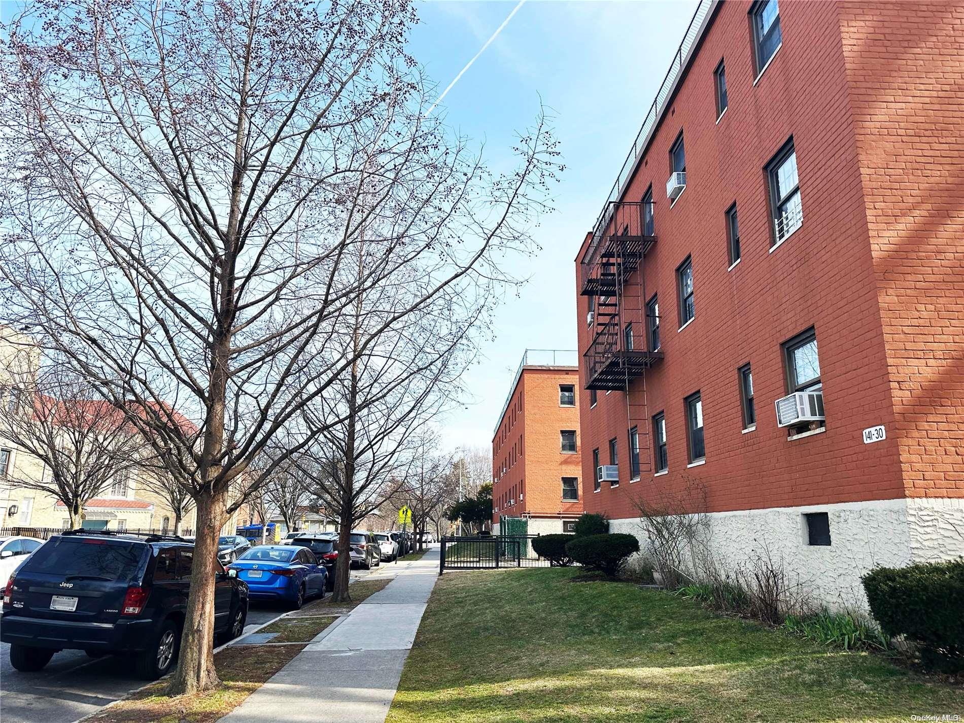 141-30 77th Road, Unit 3A Queens, NY 11367 - Photo 17 of 19 a view of a parked cars in front of a building