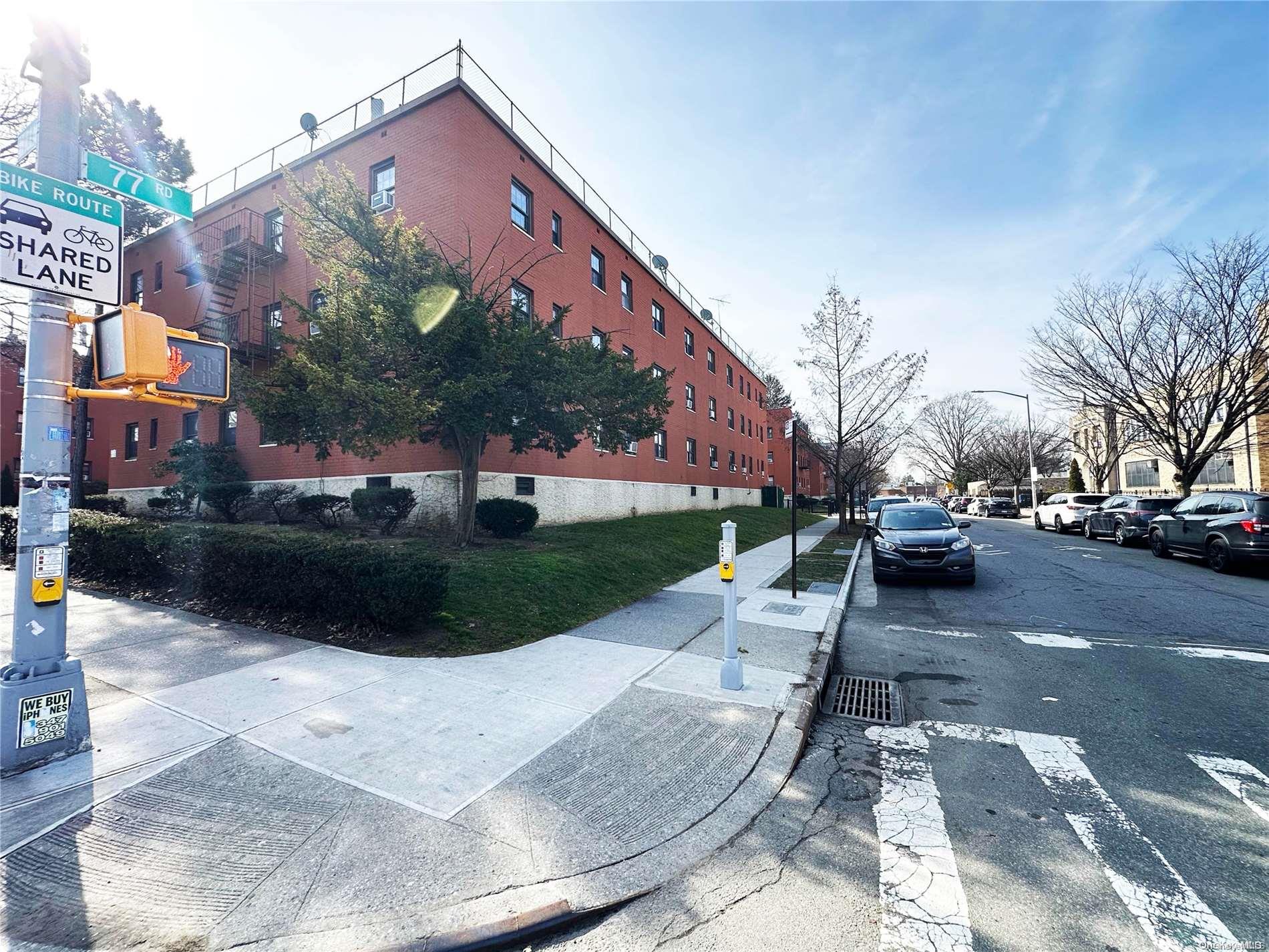 141-30 77th Road, Unit 3A Queens, NY 11367 - Photo 18 of 19 a view of a street with houses