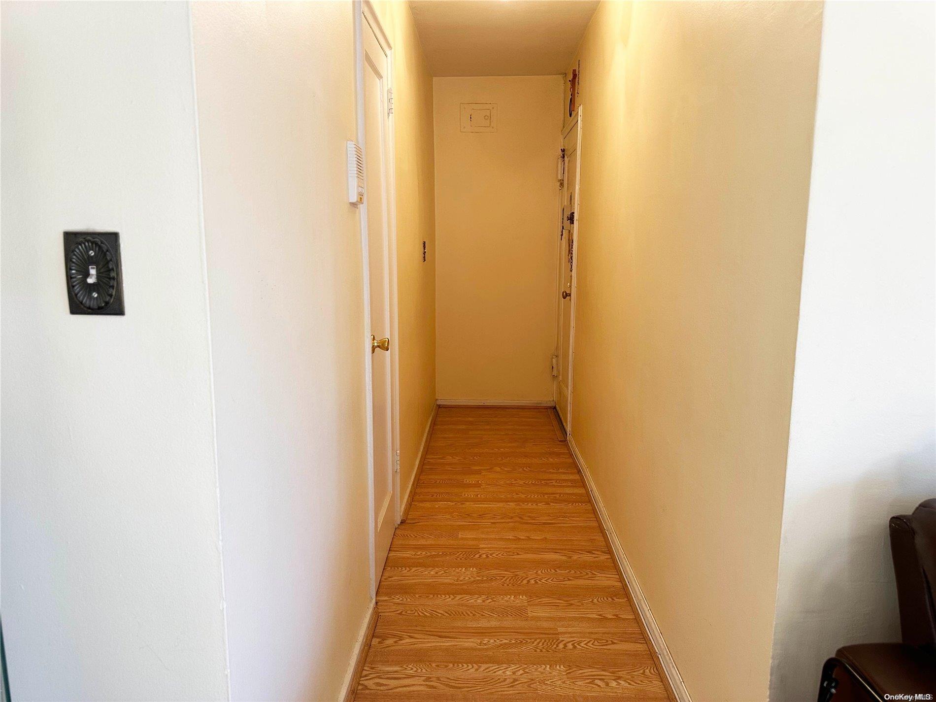 141-30 77th Road, Unit 3A Queens, NY 11367 - Photo 4 of 19 a view of a hallway with wooden floor