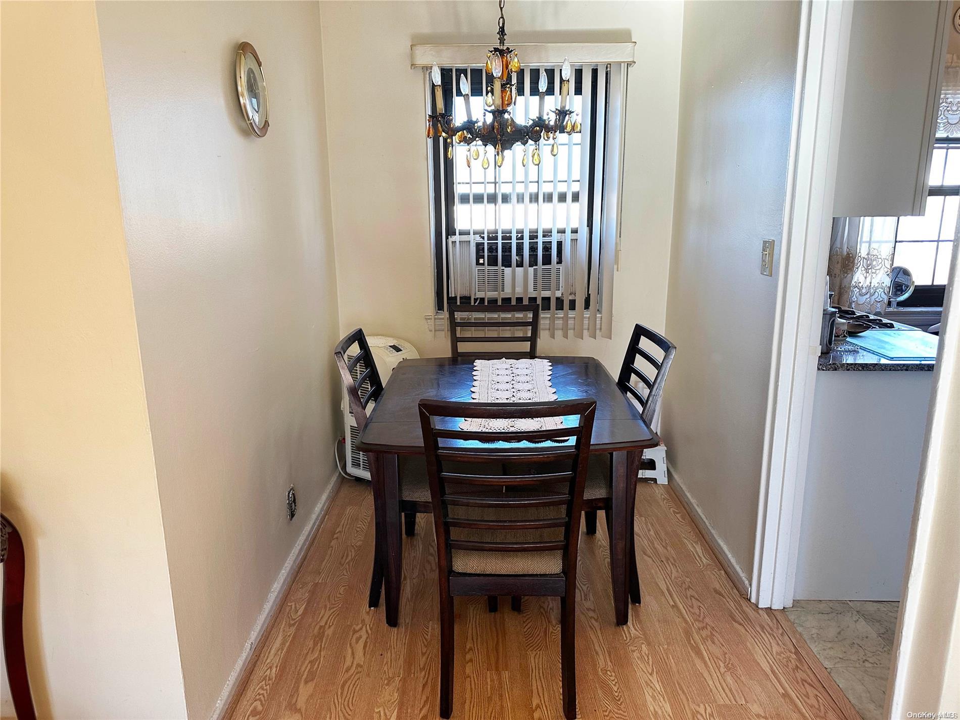 141-30 77th Road, Unit 3A Queens, NY 11367 - Photo 5 of 19 a view of a hallway with furniture and wooden floor