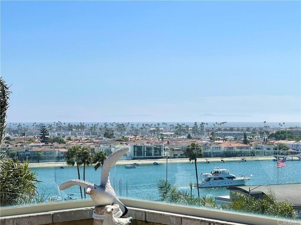 Third floor balcony with beautiful ocean views from the City, Channel, Lido Isle, Balboa Peninsula and all the way to the magnificent Pacific Ocean that can be seen from the office room, living room, entertaining room, dining room, and kitchen
