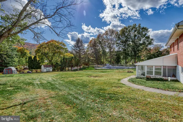 a view of a house with a big yard