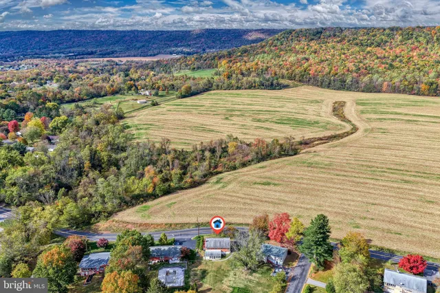a backyard of a house with lots of green space