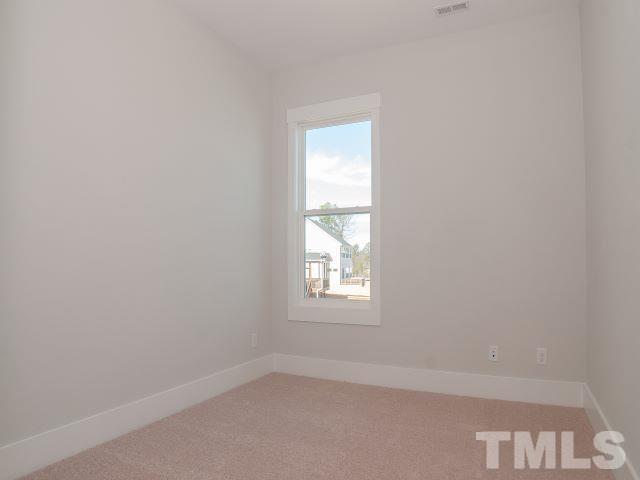 5205 Windmere Chase Drive Raleigh, NC 27616 - Photo 12 of 39 an empty room with a window