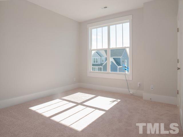 5205 Windmere Chase Drive Raleigh, NC 27616 - Photo 16 of 39 an empty room with windows