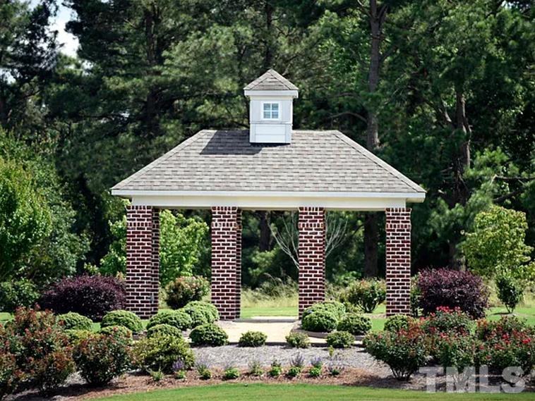 5205 Windmere Chase Drive Raleigh, NC 27616 - Photo 33 of 39 a front view of a house with garden
