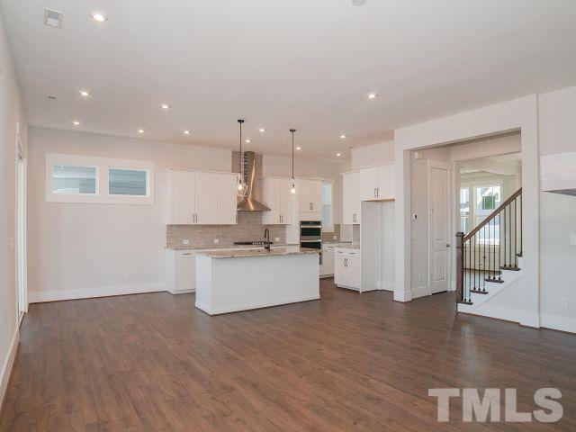 5205 Windmere Chase Drive Raleigh, NC 27616 - Photo 6 of 39 a large kitchen with a large counter top appliances and cabinets