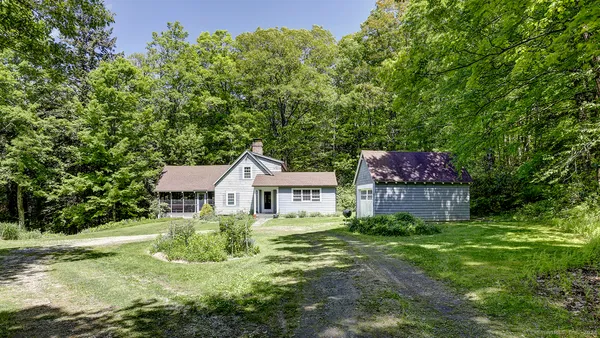 a house with a tree in front of it