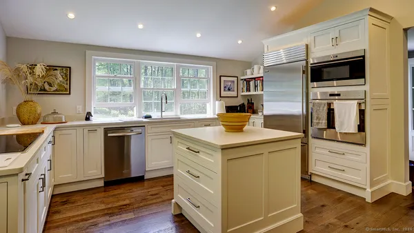 a kitchen with a stove and a microwave