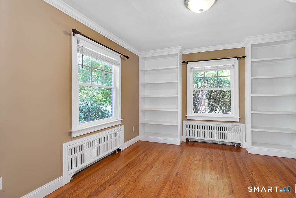 134 Dyer Street New Haven, CT 06511 - Photo 13 of 26 an empty room with wooden floor and windows
