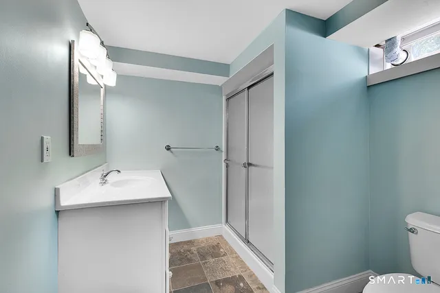 a bathroom with a sink toilet and vanity