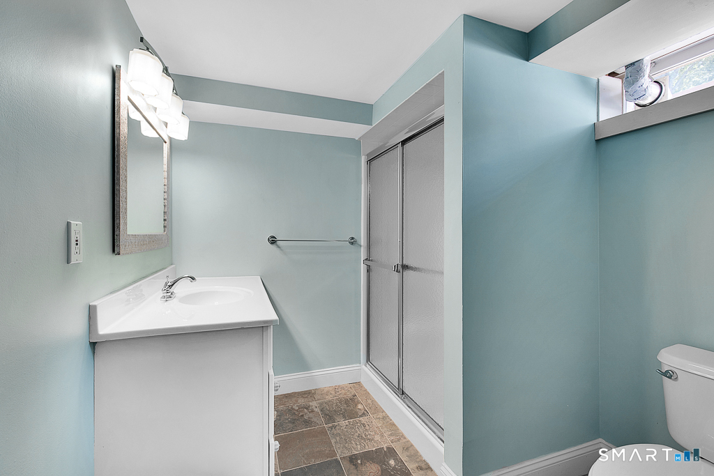 134 Dyer Street New Haven, CT 06511 - Photo 23 of 26 a bathroom with a sink toilet and vanity