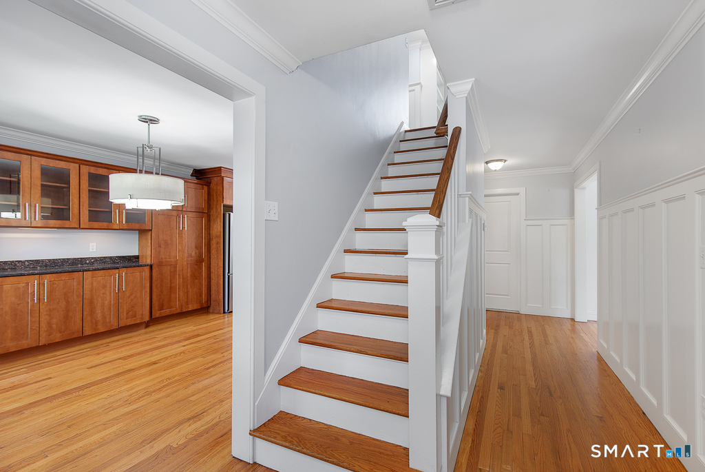 134 Dyer Street New Haven, CT 06511 - Photo 5 of 26 a view of a kitchen with wooden floor and stairs