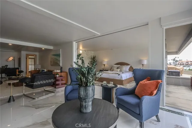 a living room with furniture flowerpot and a window