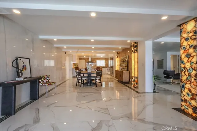 a lobby with furniture and a table