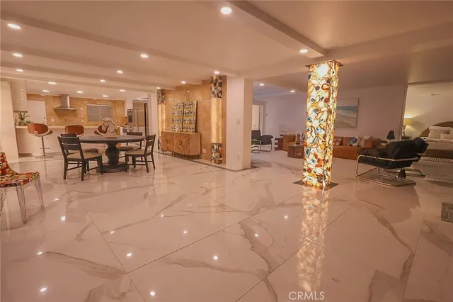 a view of a living room and kitchen