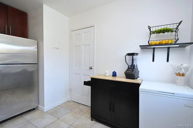 a kitchen with a sink and a refrigerator