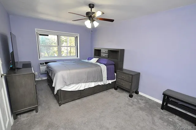 a bed room with a bed and a chandelier