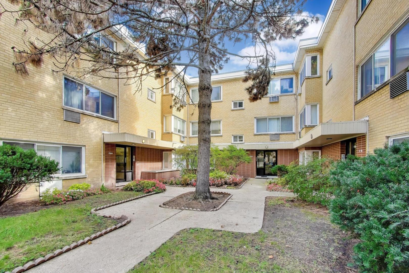 a view of a building with a yard