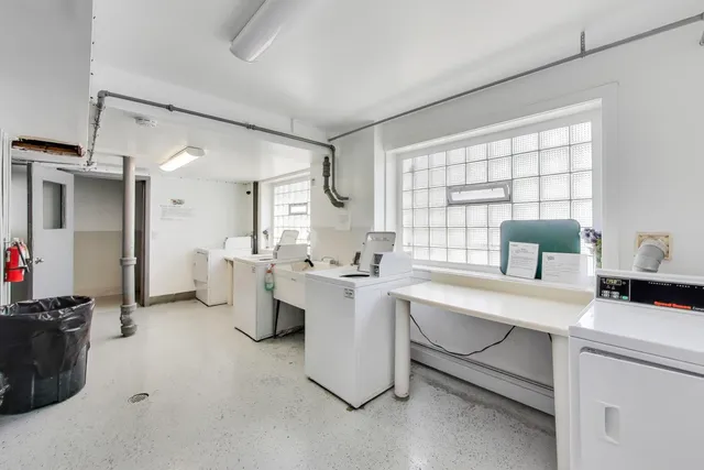 a kitchen with a sink appliances and cabinets