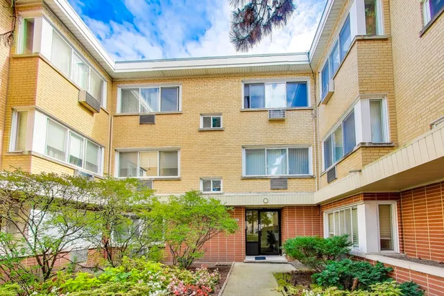 a front view of a multi story residential apartment building