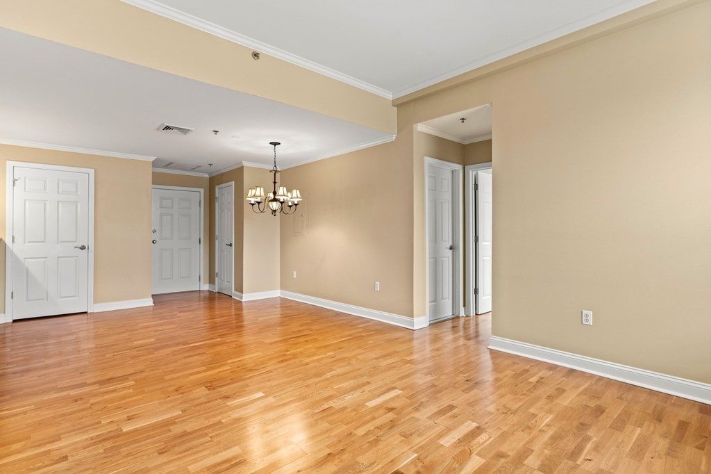 17 Central Street, Unit 9 Salem, MA 01970 - Photo 13 of 27 a view of an empty room with wooden floor