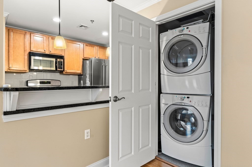 17 Central Street, Unit 9 Salem, MA 01970 - Photo 23 of 27 a view of a kitchen with washer and dryer