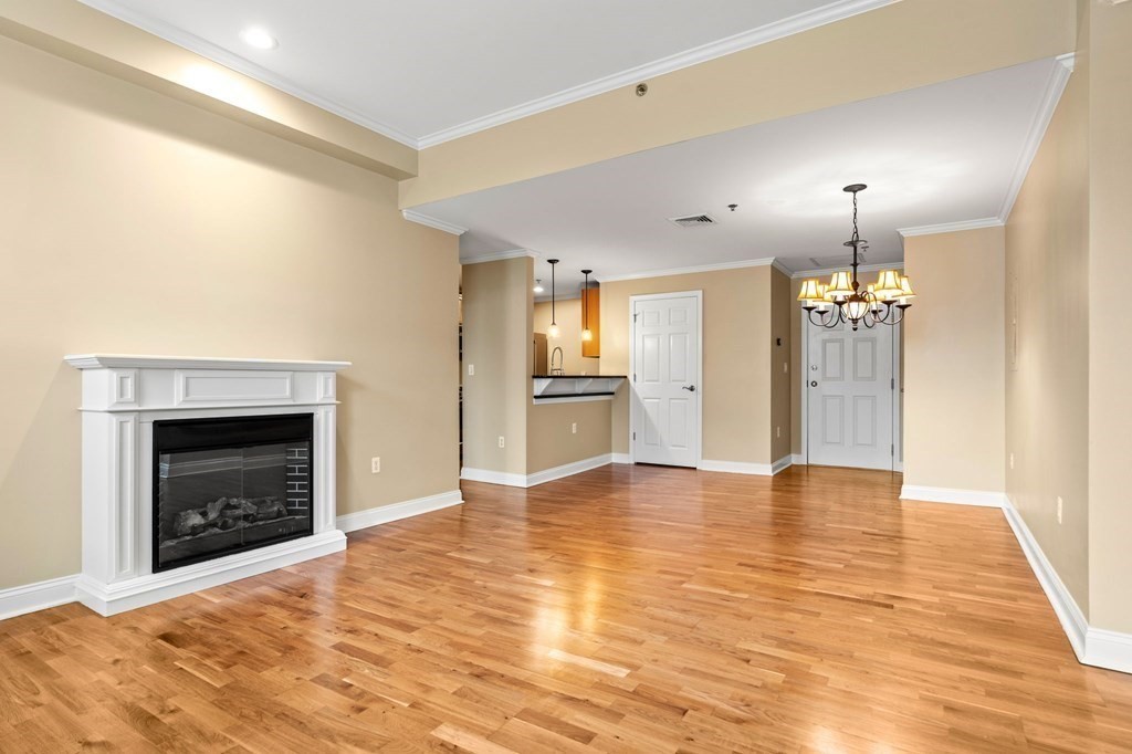 17 Central Street, Unit 9 Salem, MA 01970 - Photo 10 of 27 a view of an empty room with window and fire place