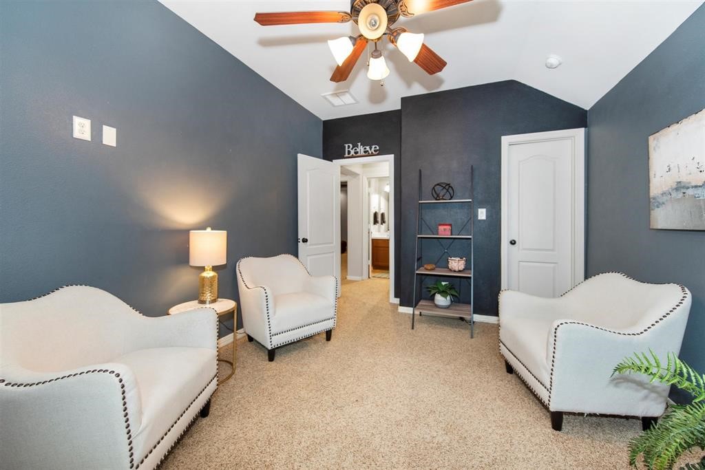 8323 Floating Heart Court Conroe, TX 77385 - Photo 26 of 43 a spacious bedroom with a bed and a walk in closet