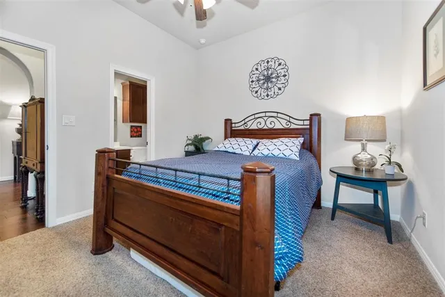 a bed room with a bed and a lamp