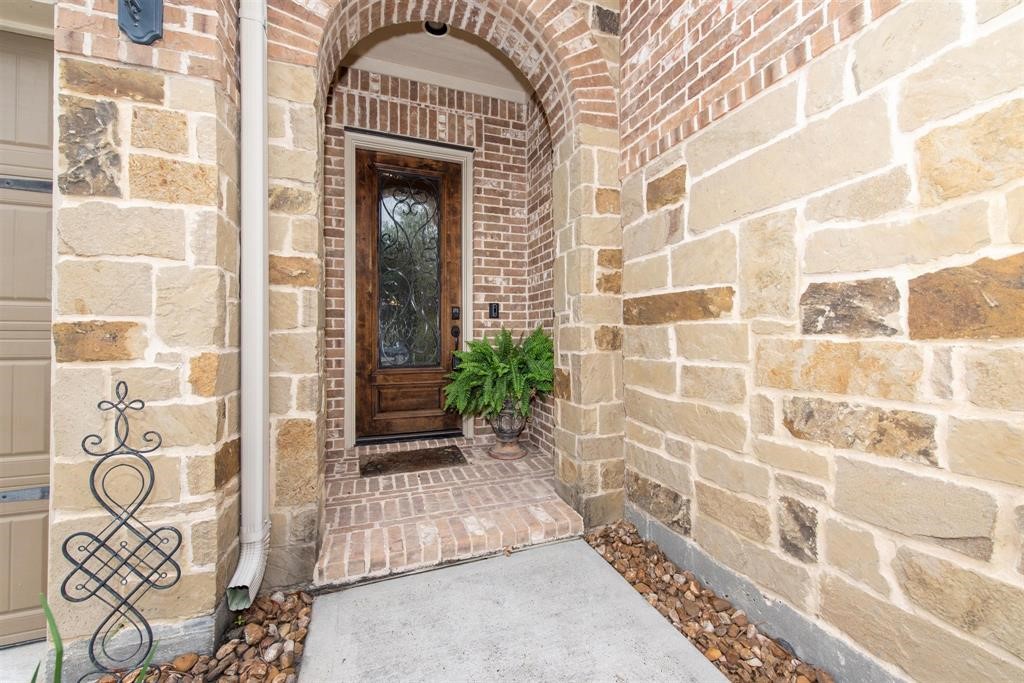 8323 Floating Heart Court Conroe, TX 77385 - Photo 3 of 43 a view of a door with glass windows
