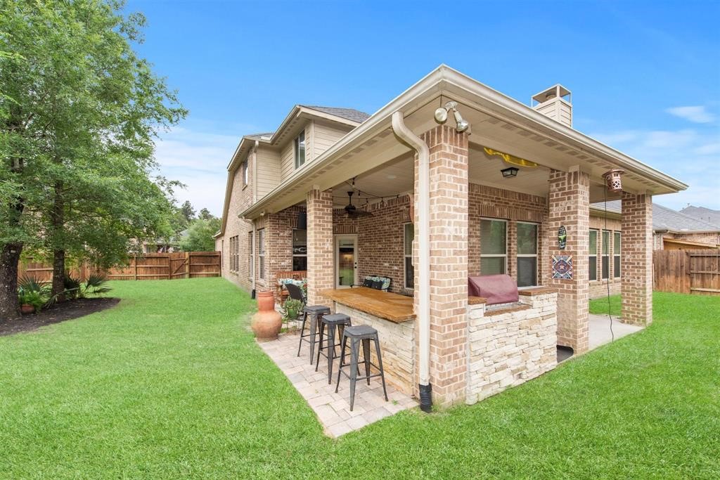 8323 Floating Heart Court Conroe, TX 77385 - Photo 39 of 43 a front view of a house with a yard