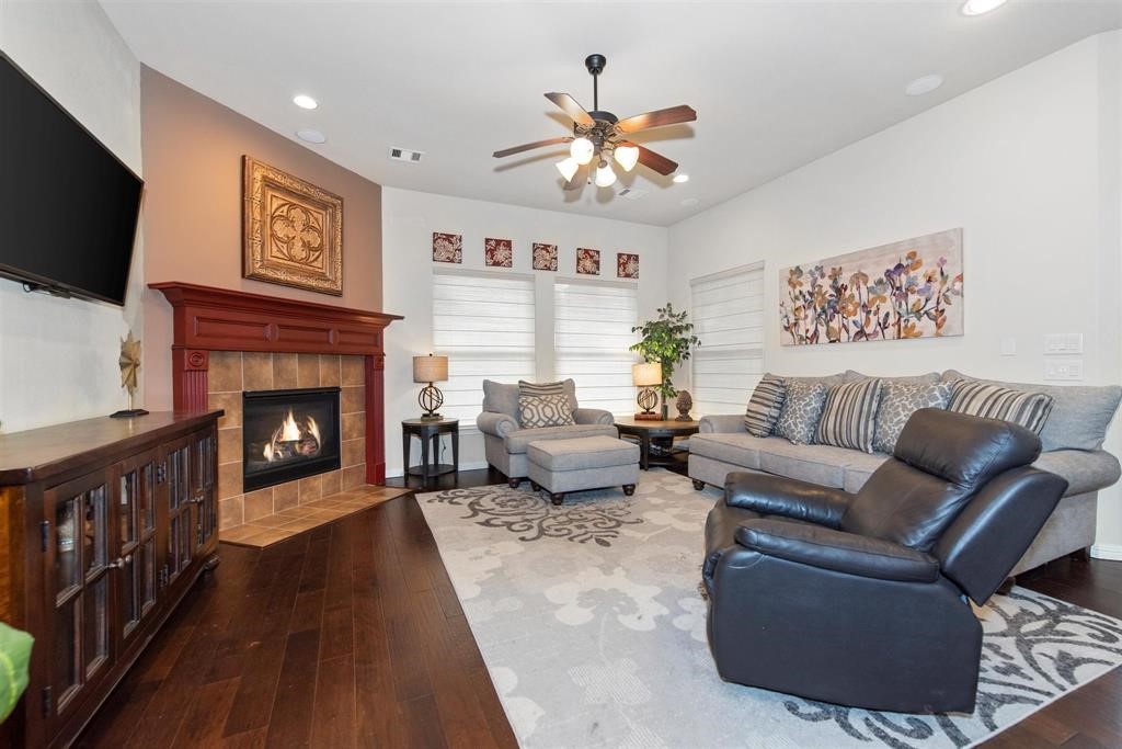 8323 Floating Heart Court Conroe, TX 77385 - Photo 10 of 43 a living room with furniture and a fireplace