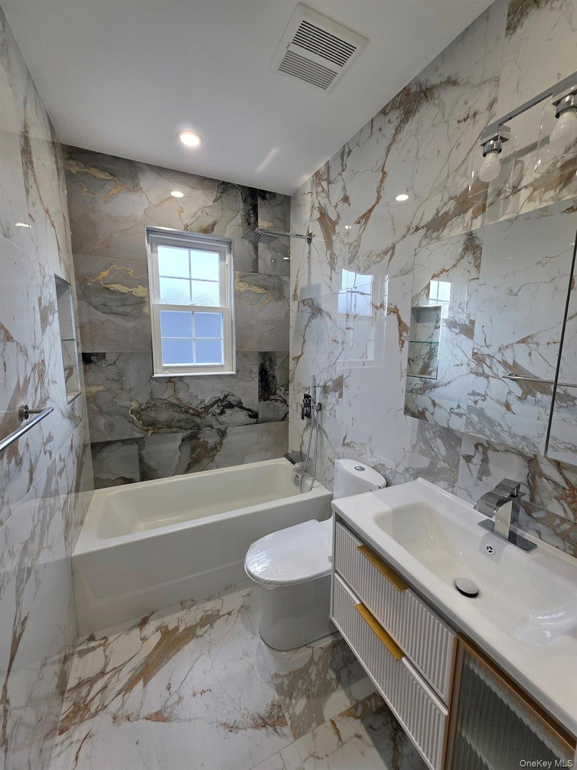 240-02 147th Road Queens, NY 11422 - Photo 10 of 19 a bathroom with a sink toilet bathtub and shower