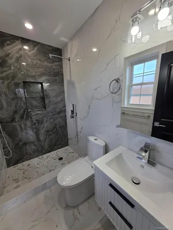 a bathroom with a sink toilet bathtub and shower