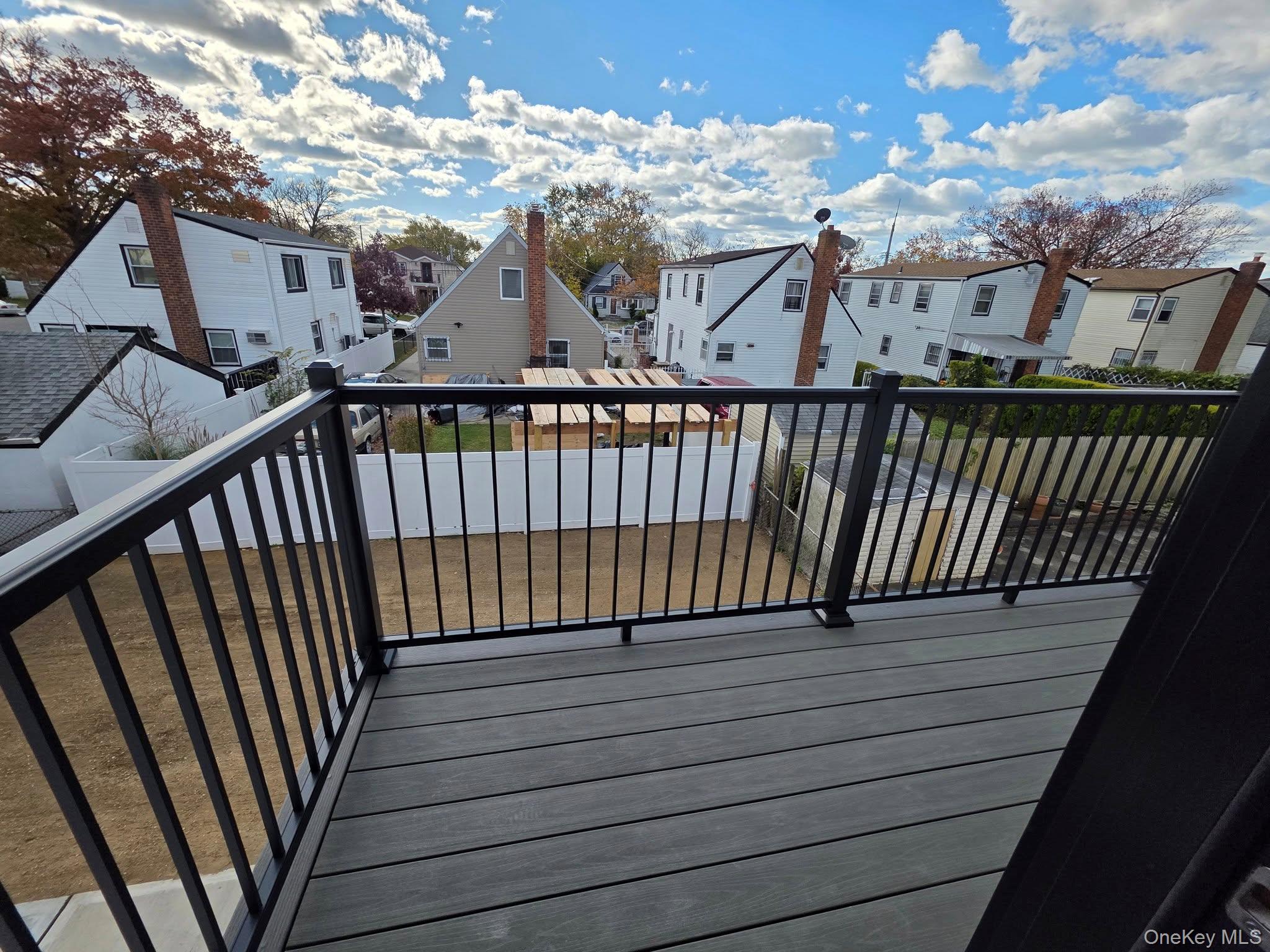 240-02 147th Road Queens, NY 11422 - Photo 14 of 19 a view of balcony with wooden floor