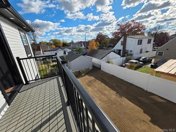 a view of balcony with wooden floor