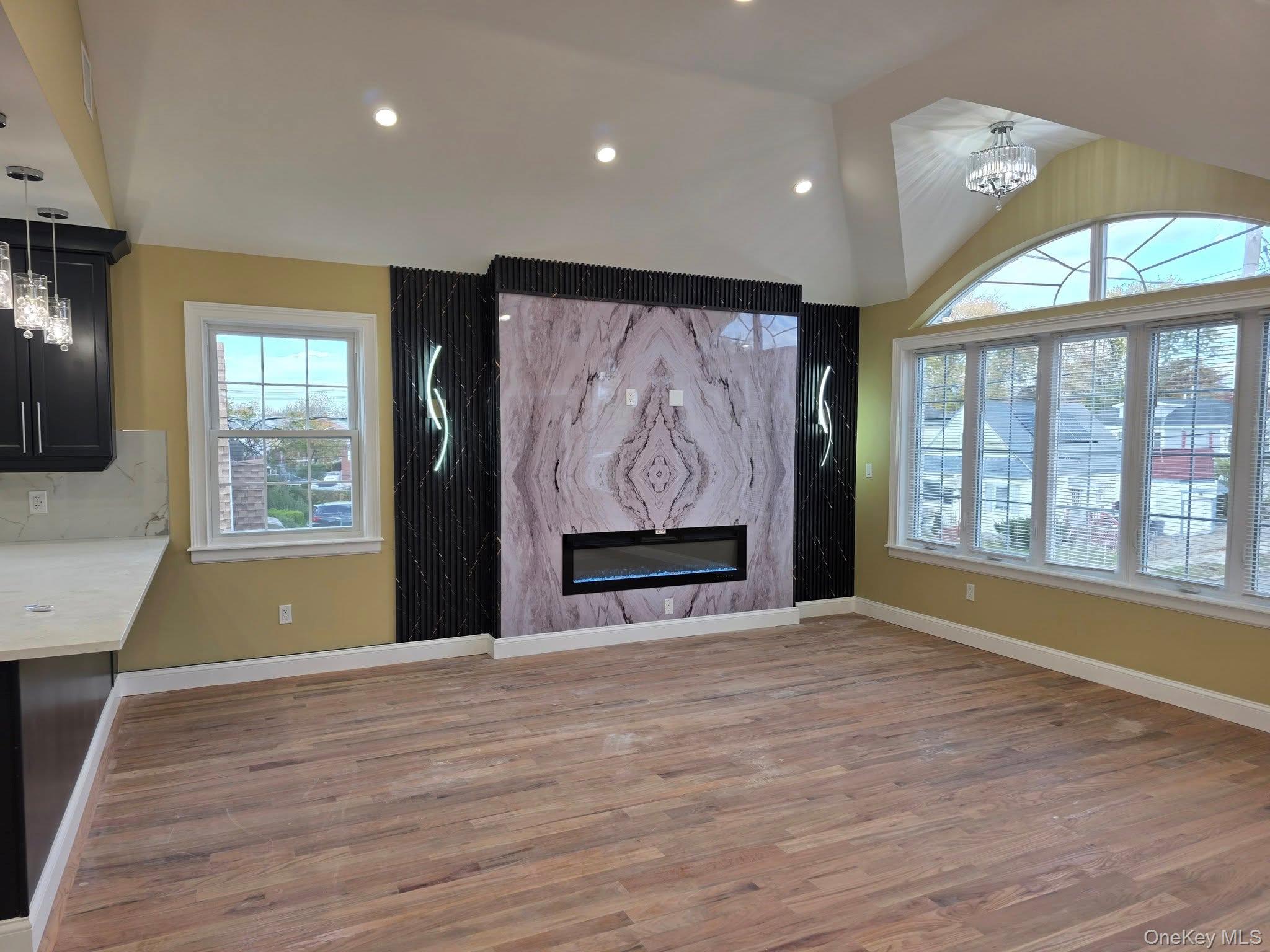 240-02 147th Road Queens, NY 11422 - Photo 4 of 19 a view of an empty room with glass door and a window