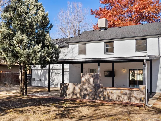 a view of a house with a tree