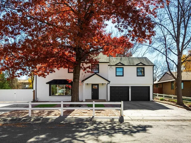 a front view of a house with a street