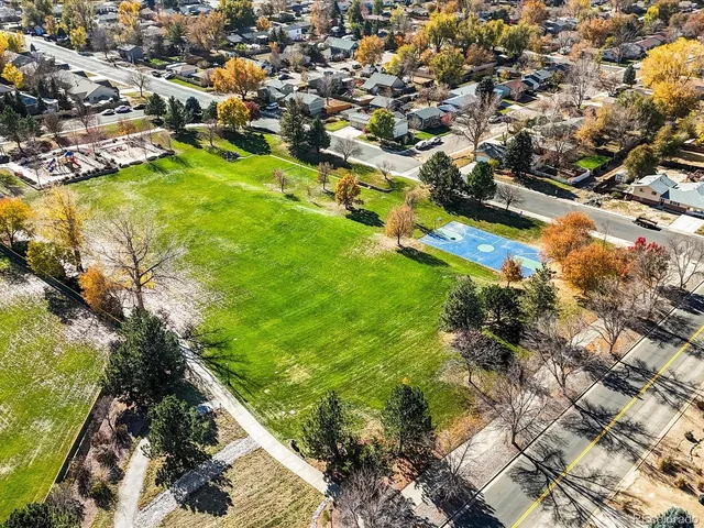 an aerial view of a pool a yard and lake view