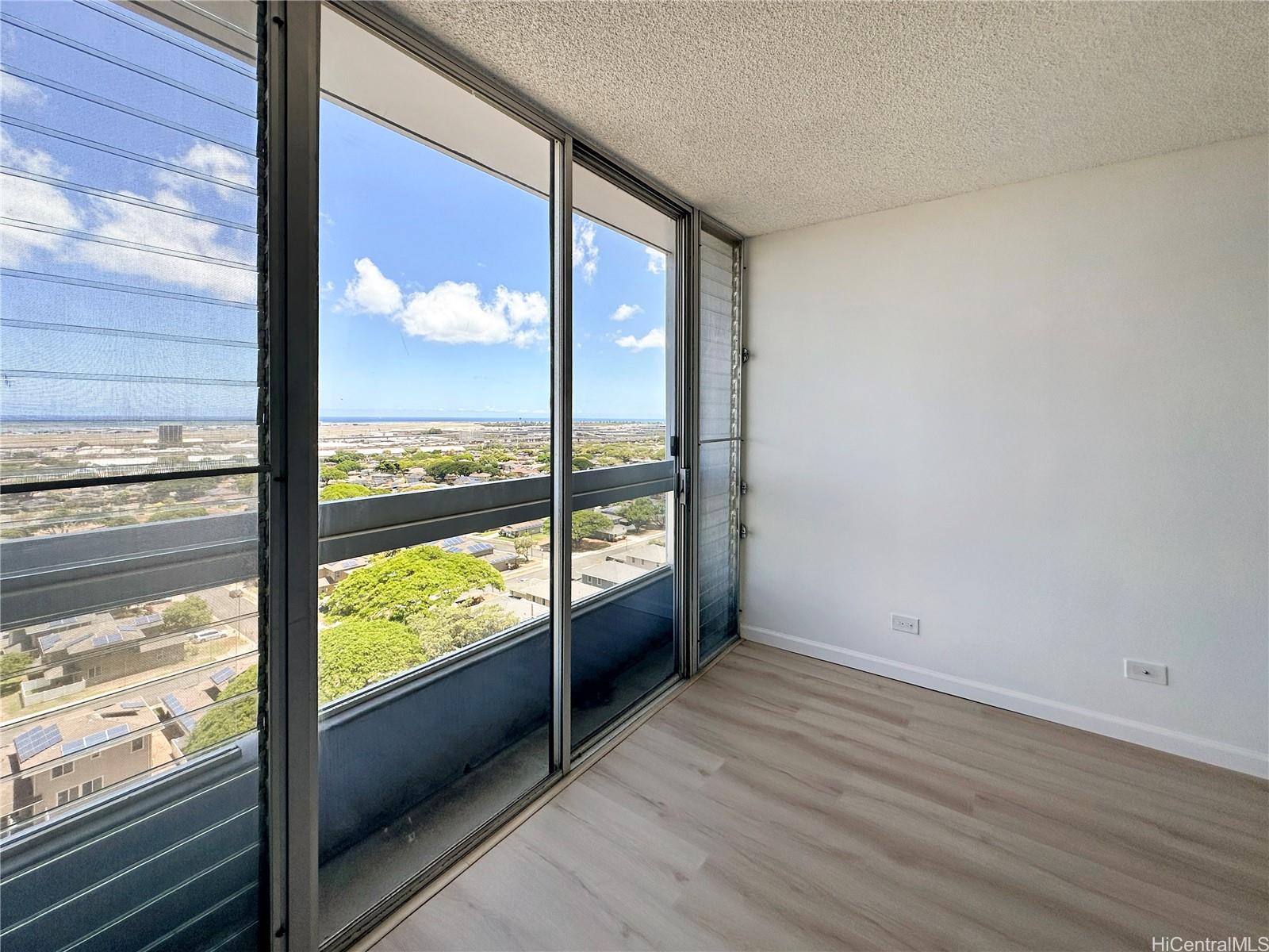 3045 Ala Napuaa Place, Unit 1814 Honolulu, HI 96818 - Photo 3 of 16 a view of a room with wooden floor