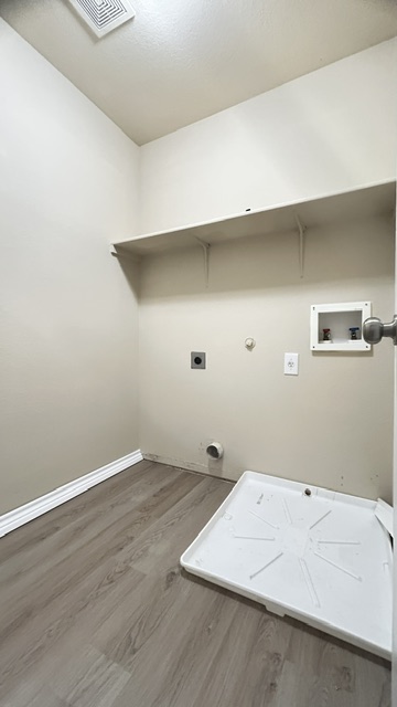 5211 Viewpoint Drive Austin, TX 78744 - Photo 18 of 25 an empty room with wooden floor